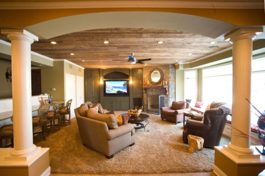 Finished basement remodel featuring open living space, custom lighting, and modern design by Cardinal Remodeling.