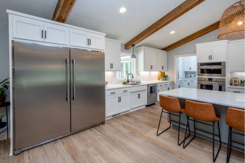 Modern Minnesota kitchen remodel with custom cabinetry, quartz countertops, and open layout by Cardinal Remodeling